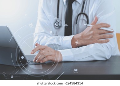 Close Up Of Smart Medical Doctor Working With Digital Tablet Computer And Stylus Pen And Stethoscope On Dark Wooden Desk With Virtual Icon Diagram