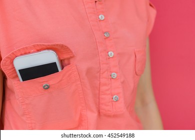 Close Up Smart Phone In Pink Shirt Pocket.