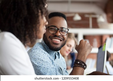 Close Up Of Smiling African American Employee Look At Female Colleague Chatting In Office, Happy Black Male Worker Talk With Woman Coworker, Having Casual Conversation At Workplace, Have Fun