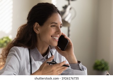 Close Up Smiling Female Doctor Talking, Using Smartphone, Friendly Professional Physician Therapist Consulting Patient, Explaining, Discussing Medical Checkup Results Or Treatment By Phone Call