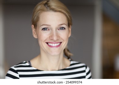 Close Up Of A Smiling Italian Blond Woman