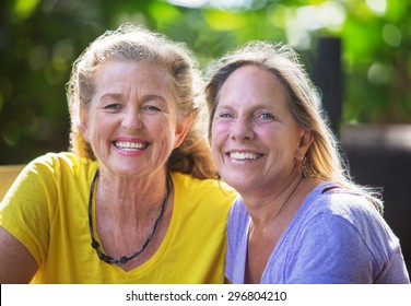 Close Up Of Smiling Mature Caucasian Female Friends