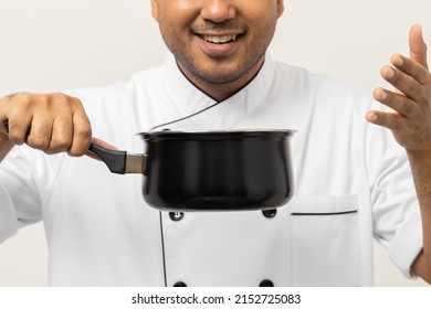 Close Up Smiling Young Man Chef In Uniform Gesture Smelling Empty Hot Pot Delicious Dish Menu Good Taste On Isolated. Cooking  Man Occupation Chef People In Kitchen Restaurant And Hotel.