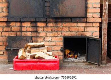 Close Smokehouse With Wood And Fire