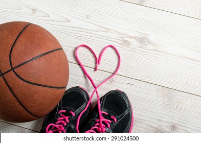 Close up of sneakers with lace heart and basket ball