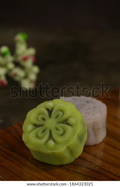 Close up of Snow Moon Cake or Kue Bulan as\
celebration cake for mid autumn festival for Chinese tradition.\
Oriental pattern on cake\'s surface,\
copy