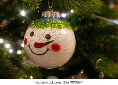 Close up of a snowman Christmas decoration hanging on the Christmas tree - Powered by Shutterstock