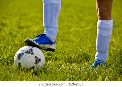 Close up of a soccer ball and a feet of a soccer player 3