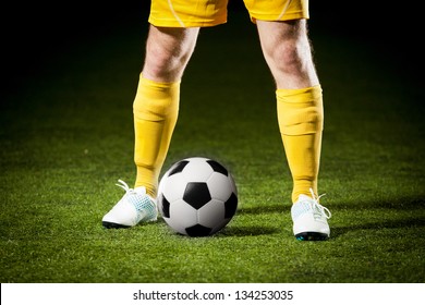 Close Up Of A Soccer Ball And A Feet Of A Soccer Player