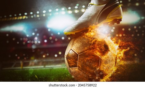 Close up of a soccer striker ready to kicks a fiery ball at the stadium - Powered by Shutterstock