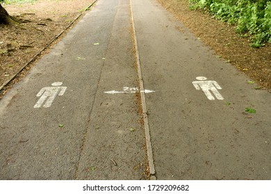 Close Of Social Distancing Signs Of People To Keep  Two Metres Apart On Public Pathway In The Summer