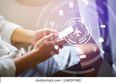 Close Up Soft Focus On Businessman Hand Holding Smartphone For Checking Work Or Playing In The Aircraft With Virtual Interface Of Air Transportation Symbol Technology,business Travel Concept