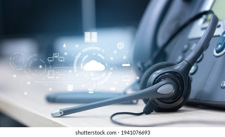 Close Up Soft Focus On Headset With Telephone Devices At Office Desk For Customer Service Support With Saas Technology Communication Icon Concept