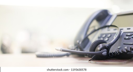 Close Up Soft Focus On Telephone Devices With Copy Space Background At Office Desk In Operation Room For Customer Service Support (call Center) Concept