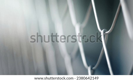 Close up Solid Metallic Wire Mesh Chain link Fence in Vintage Style Steel. Selective focus wire mesh fence