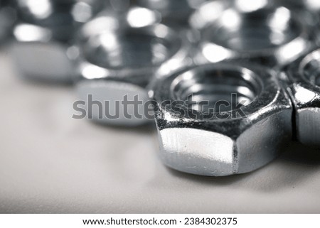 Close up of some metal nuts for fixing of fasteners