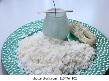 CLose Up Of Soy Wax Parsley Flakes In A Plate. Main Ingredient For Candle Making. 