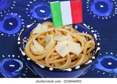 Close Up To Spaghetti With Cheesee And Italian Flag In Blue Bowl On Dark Blue Eye Background