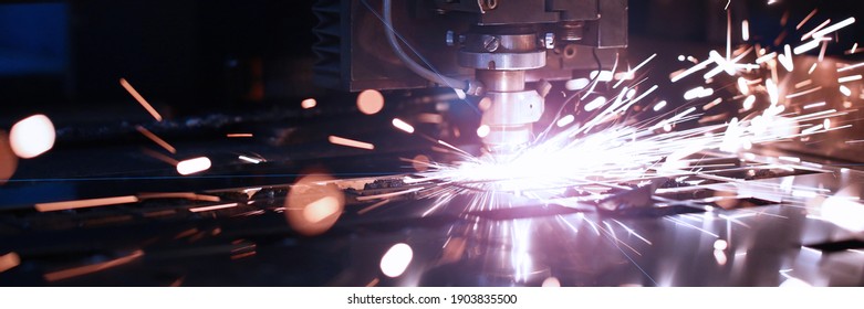 Close Up Of Sparks Fly Out Machine Head For Metal Processing At The Factory. Automotive Production Concept