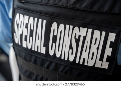 Close up of special constable text on police uniform vest.