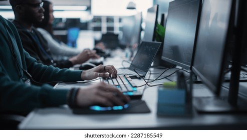 Close Up Specialist Working on Computer, Programming a Software for an Innovative Technological Internet Product Launch. Diverse Multicultural Team Working in a Startup Agency - Powered by Shutterstock