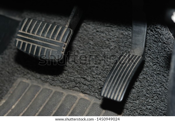 Close\
up speed and brake pedal on the automatic gear\
car.