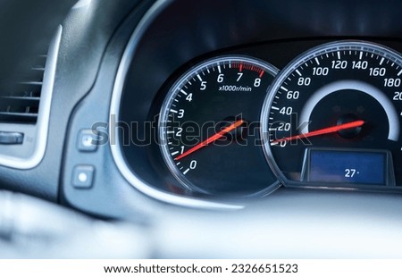 Close up of a speedometer in a car with shallow depth of field