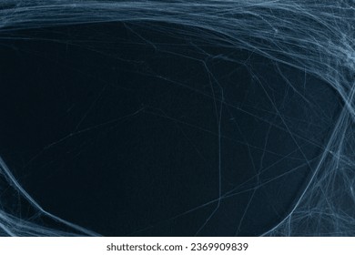 close up spider's web on retro vintage black color background for halloween night party design concept concept