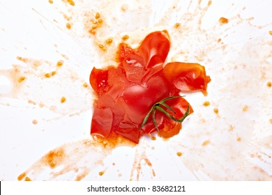 Close Up Of  A Splattered Tomato On White Background