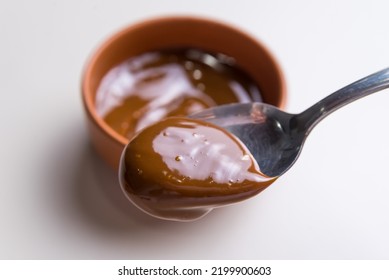 Close Up Of Spoon In Dulce De Leche