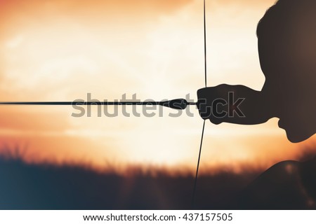 Close up of sportswoman practising archery on a white background against orange sunrise
