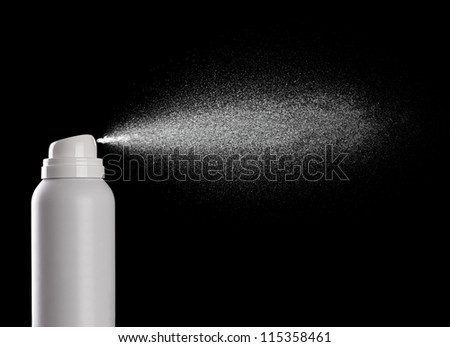close up of  a spray bottle drops on black background