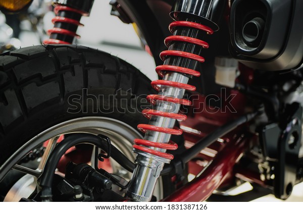 Close\
up the spring and the shock absorbers motorcycle. Hydraulic shock\
absorber oil cylinder.Motorcycle vibration\
system.