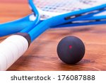 Close up of a squash rackets and balls 