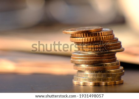 Close up stack of coin on table background and business or finance saving money