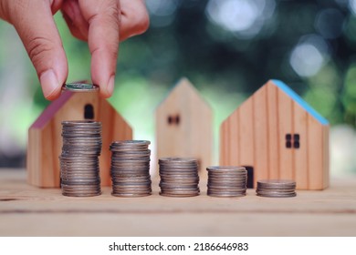 Close Up Stack Of Coin And Toy Wood House On Table, Saving And Manage Money For Building, Home Insurance Business Technology, Subprime Mortgage Crisis Risk And Problem Concept