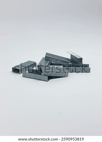 Close up stack of metal staples for staple. Isolated on white background.