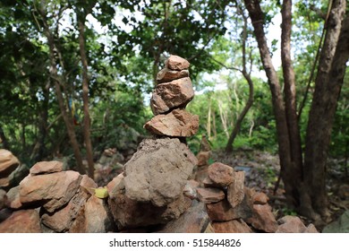Close up stack of pebble stones on the nature background,shallow depth of field,light and shadow
