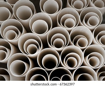 Close up of stack of plastic pipes