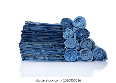 Close up Stack of rolled jeans and different jeans on white background

 - Powered by Shutterstock