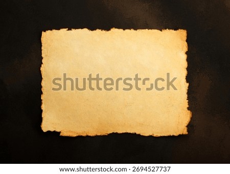 Close up stack of several blank old antique vintage brown paper parchment sheets with aged and weathered edges over dark table background