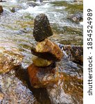 Close up of stack of stones at stream