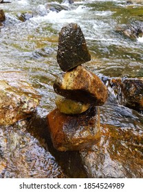 Close up of stack of stones at stream
