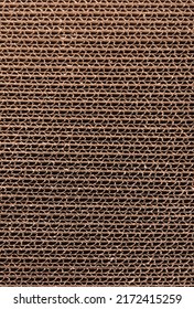 Close Up Of Stacked Brown Corrugated Cardboard Texture. Side View