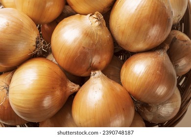 Close up of stacked raw onion with skins on bamboo basket, South Korea
 - Powered by Shutterstock