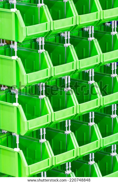 Close up\
stacks of green color plastic storage\
bin