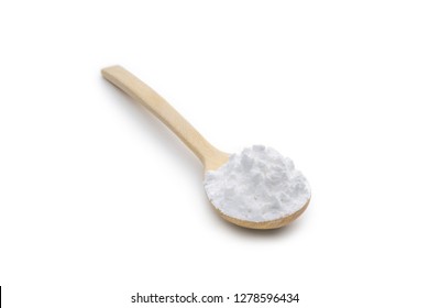 Close up of starch or flour powder on wooden spoon isolated white background with clipping path