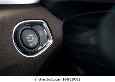 Close up of Start Stop button , Keyless entry System in modern car background.