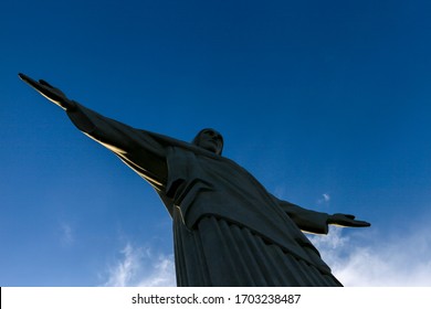 Close Up Of The Statue Of Christ The Redeemer, Seen From Under His Feet, With A Blue Sky Background. Rio De Janeiro, Brazil, February 2020.