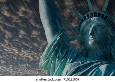 CLOSE UP STATUE OF LIBERTY WITH HEAVY RAIN AND BLACK STORM CLOUD ATMOSPHERE IN BACKGROUND, USA - Powered by Shutterstock